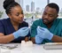 Dentist and technician compare ceramic samples for a zirconia vs E.max crowns case discussion.